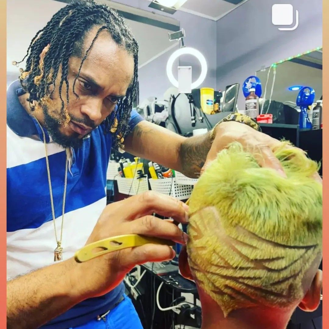 Garfield at work at Fresh Kut Barber Salon
